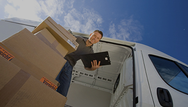 Eagle Express Logistics courier loading a delivery van